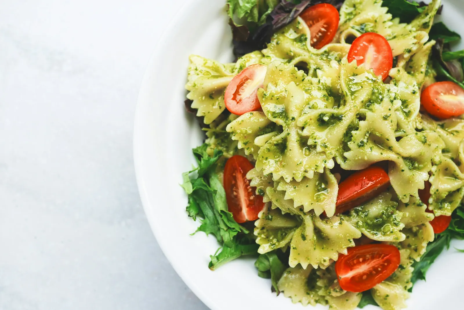 Plate of pasta with vegetables and cheese